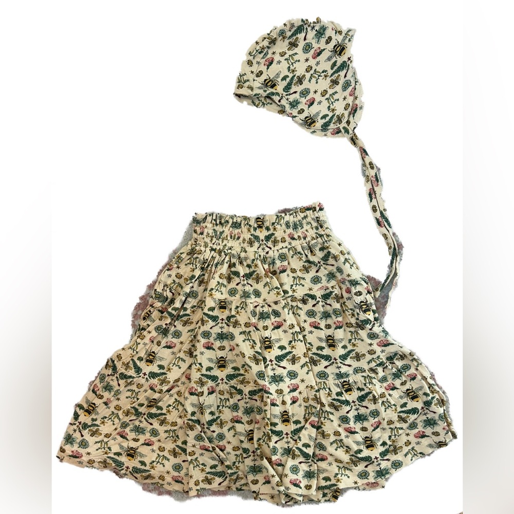 Kate Quinn litho bee smocked maxi skirt and flight hat bonnet.